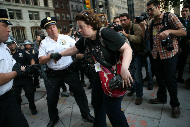 Photojournalist Julia Reinhart is arrested